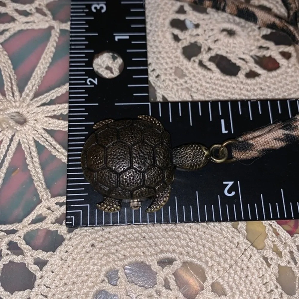 CUTE BRONZY TONED TURTLE WATCH BY STRADA needs a battery adjustable Pre owned